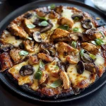 Black Pizza with Chipotle BBQ Chicken & Mushrooms