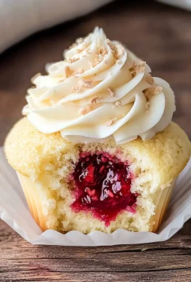 Almond Wedding Cake Cupcakes with Raspberry Filling